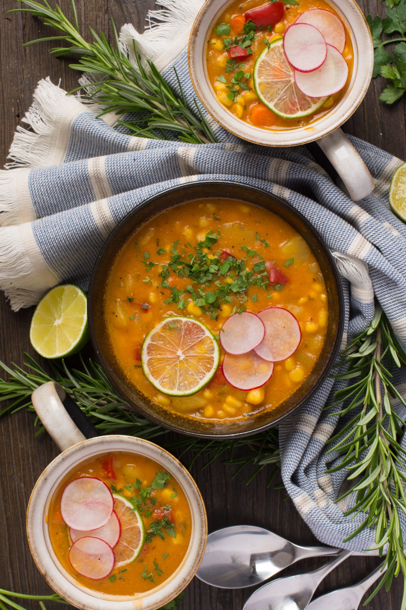 creamy corn chowder in bowl and mugs