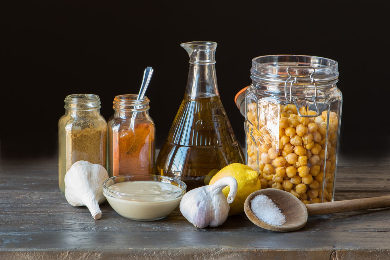 hummus ingredients in jars and bottles