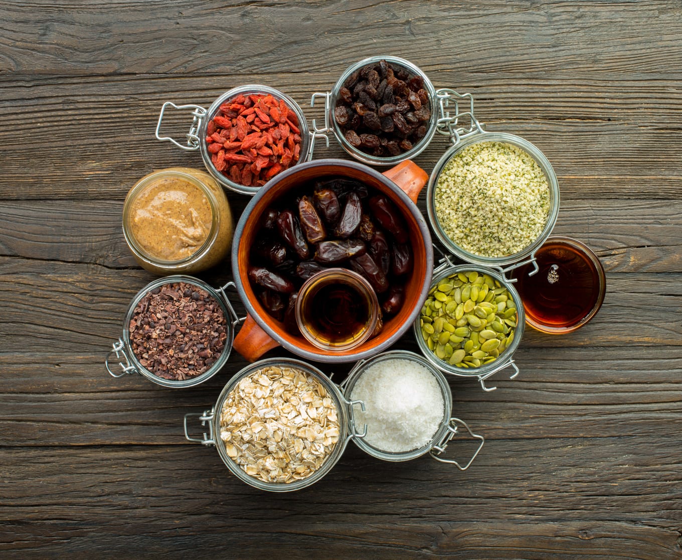 dates and other snack bar ingredients in bowls