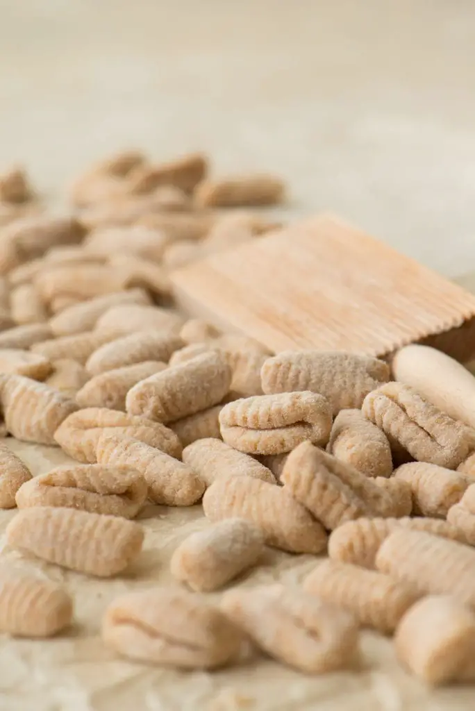 formed gnocchi next to gnocchi board