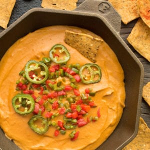 queso dip in cast iron pan
