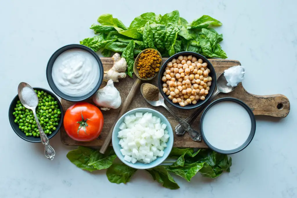 chickpea curry masala ingredients in bowls and on board