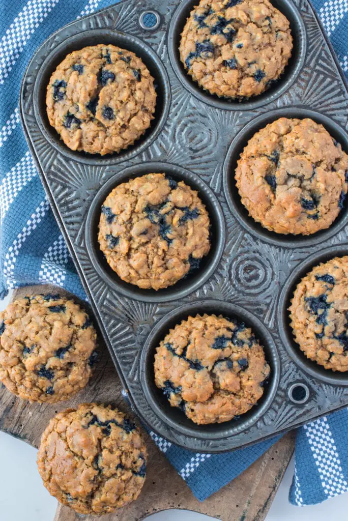 blueberry oatmeal muffins in muffin tin