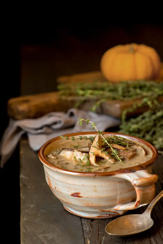 homemade mushroom soup in pottery cup