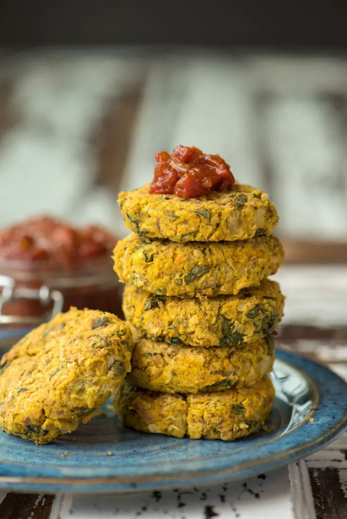 stack of white bean and artichoke patties on plate