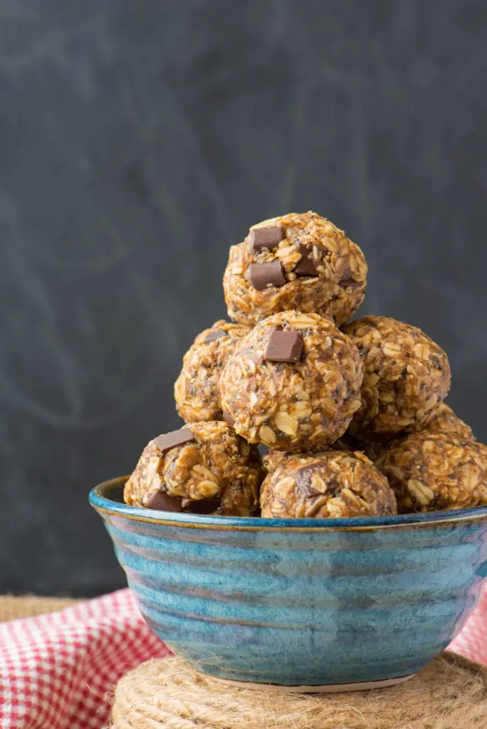 seedy almond butter energy bites in pottery bowl