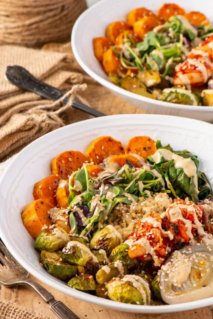 basic buddha bowl with vegetables and quinoa in two bowls