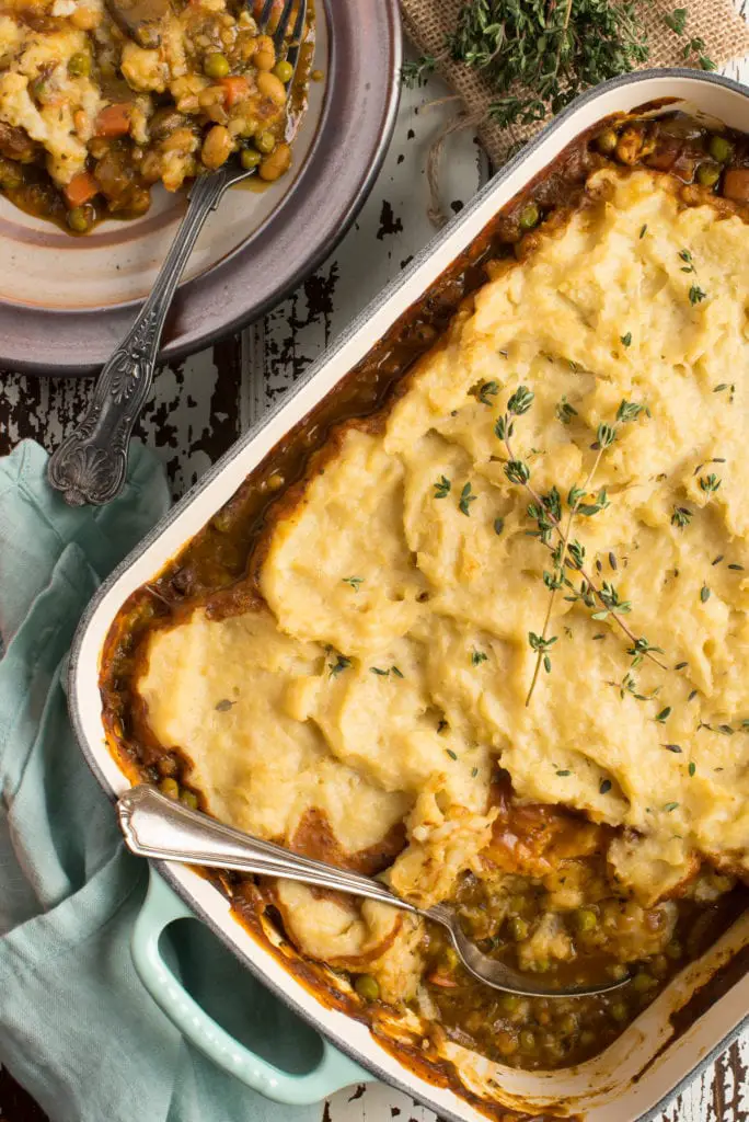 hearty vegetable shepherd's pie in pan and on plate