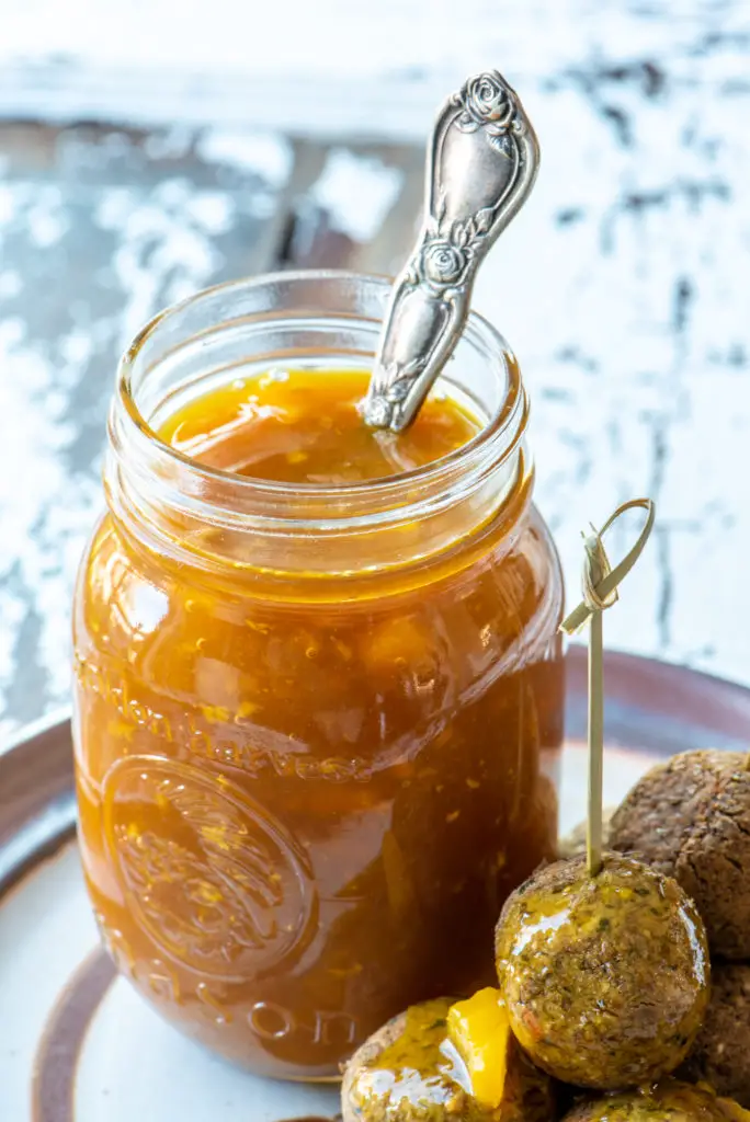 pineapple sweet and sour sauce in mason jar with spoon