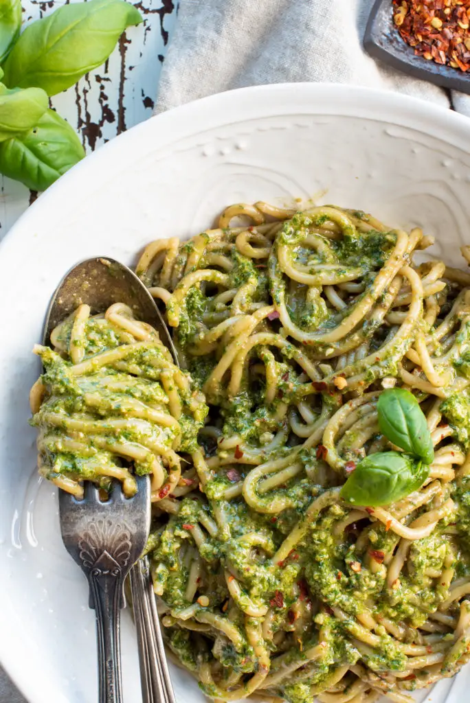 pasta in bowl with spoon and fork