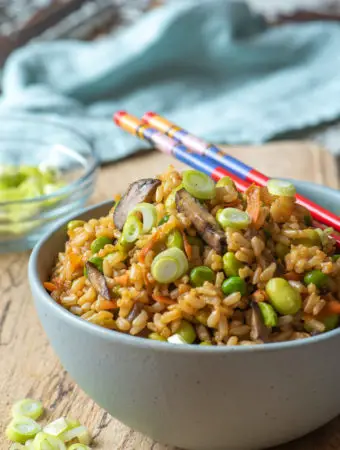 bountiful vegetable fried rice in bowl with chop sticks