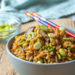 fried rice in bowl on cutting board