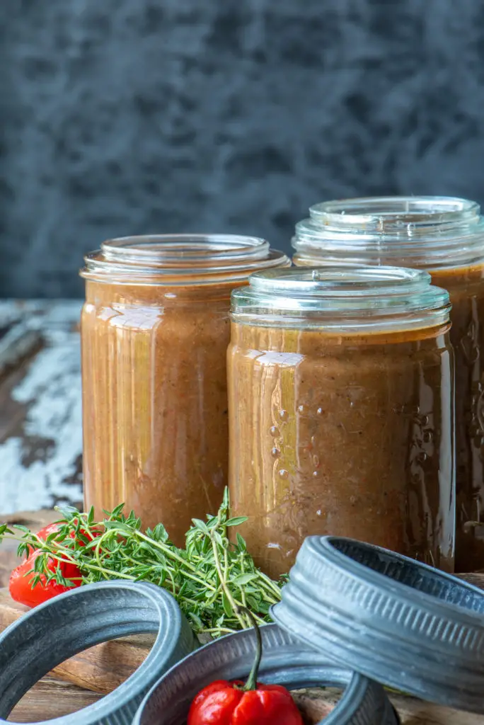 jerk style peach hot sauce in three jars