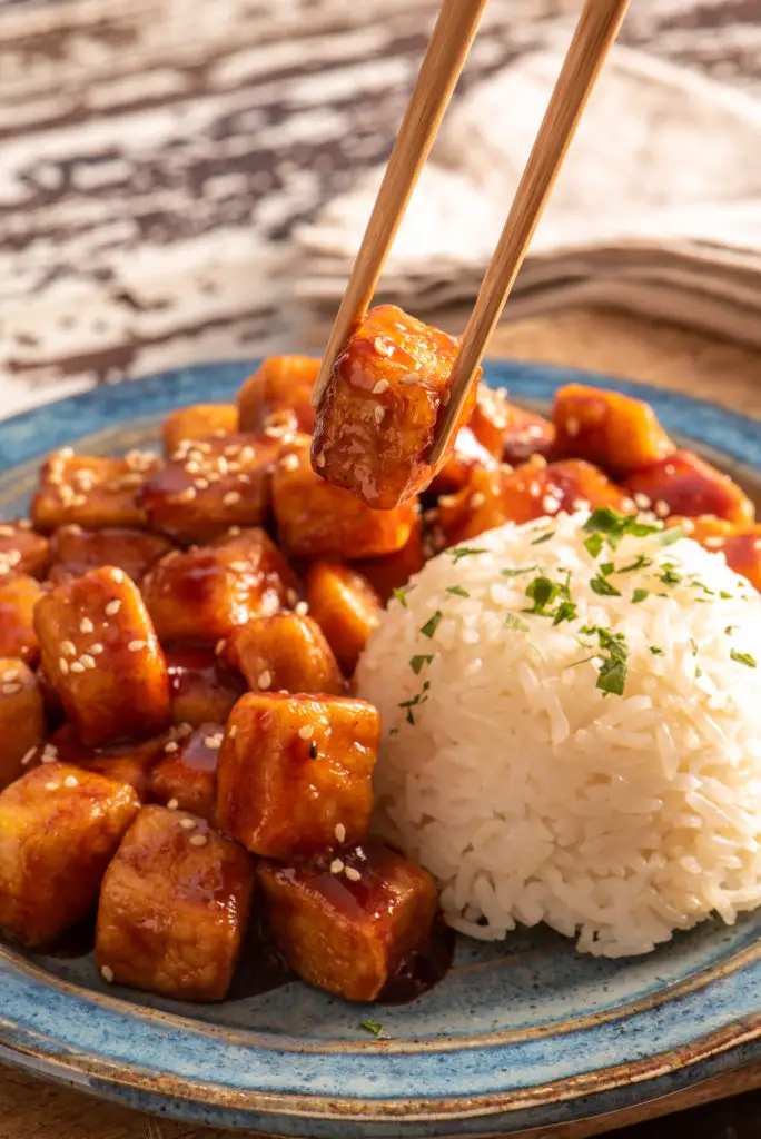 tofu on plate with chop sticks