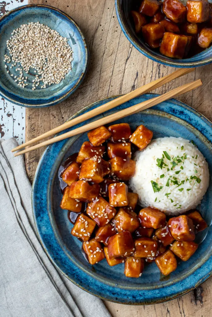 spicy sticky tofu with rice on plate