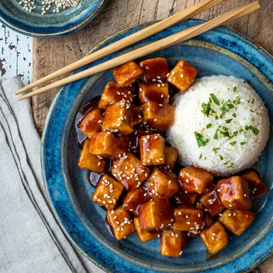 spicy sticky tofu with rice on plate