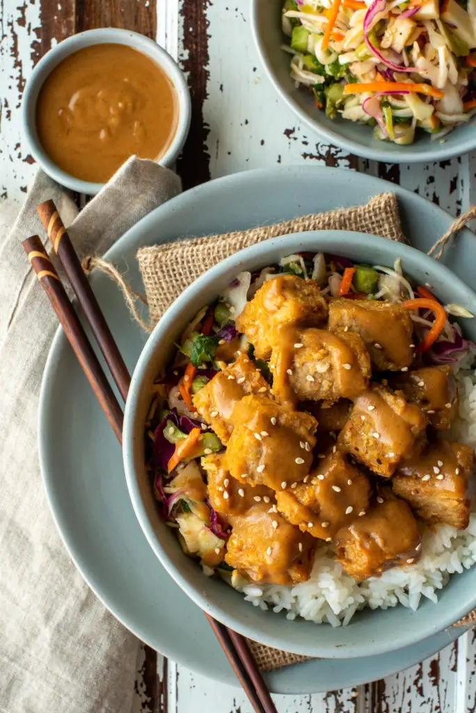 miso baked tempeh with rice and slaw in bowls