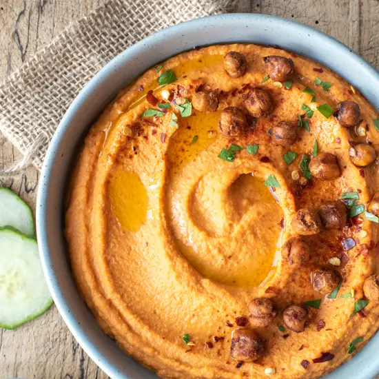 roasted red pepper in bowl sitting on burlap