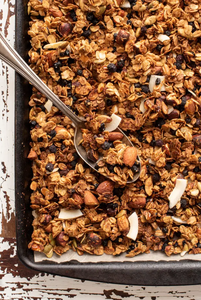 coconut blueberry granola on baking sheet