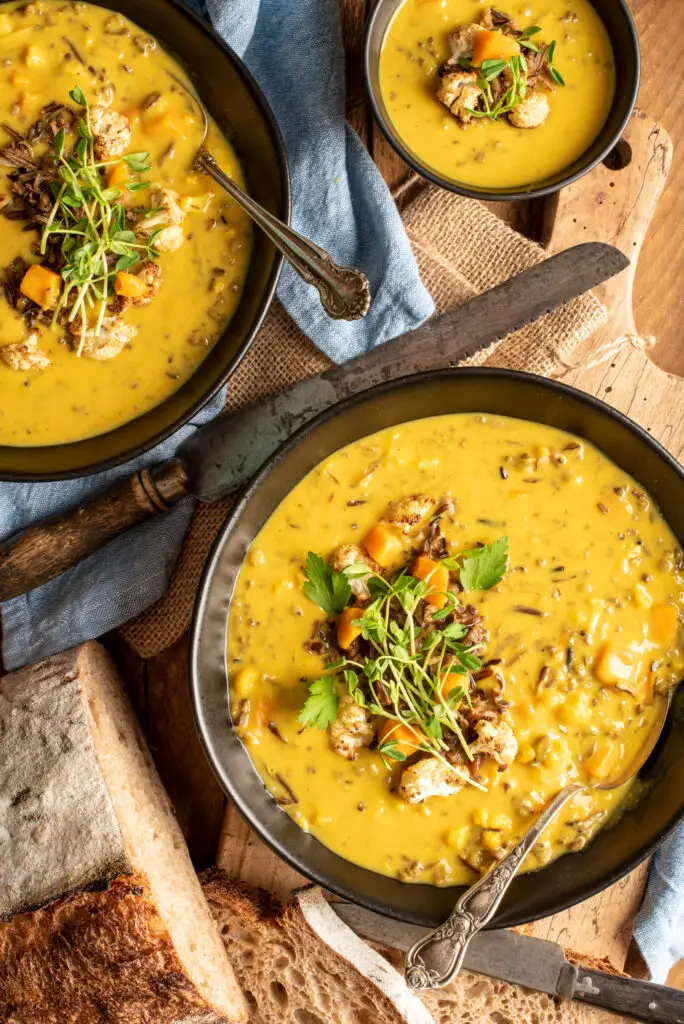 curried cauliflower and wild rice soup in bowls