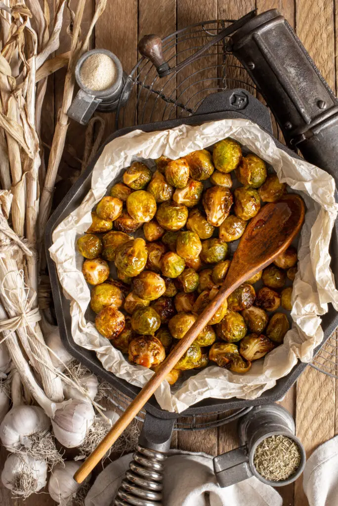 garlicky maple brussels sprouts in frying pan