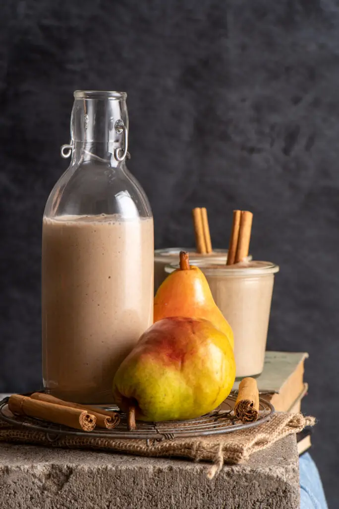 warming autumn pear smoothie in bottle and jars