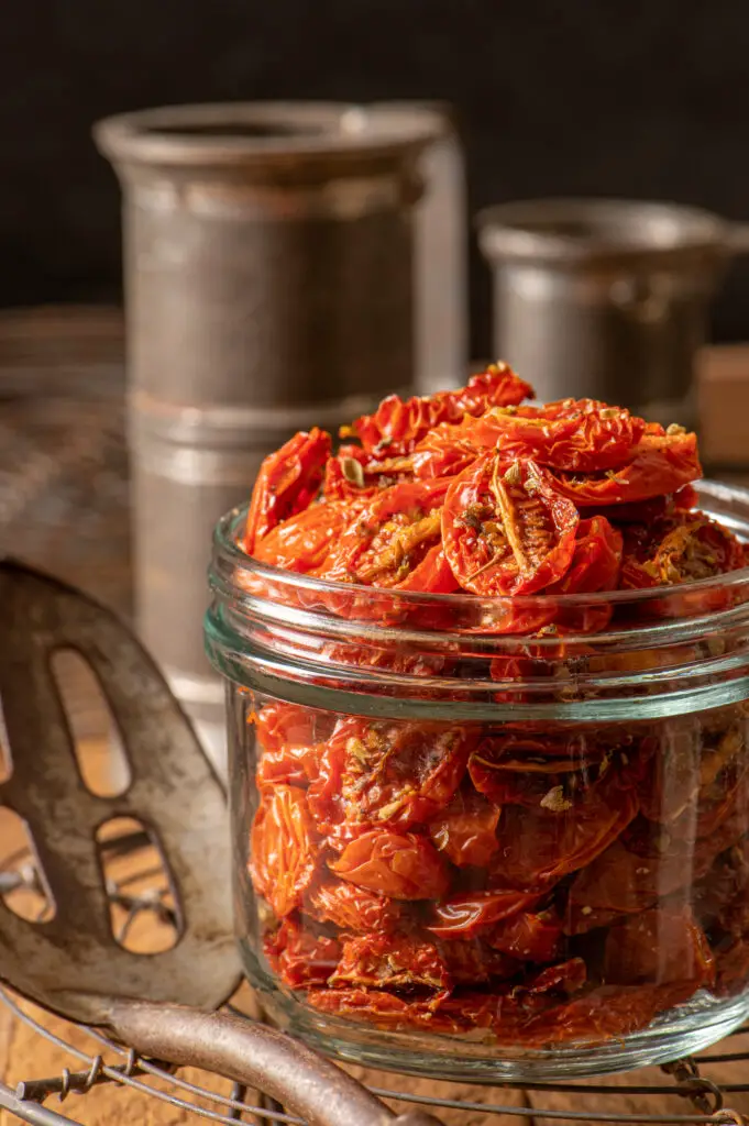 slow roasted cherry tomatoes in preserving jar