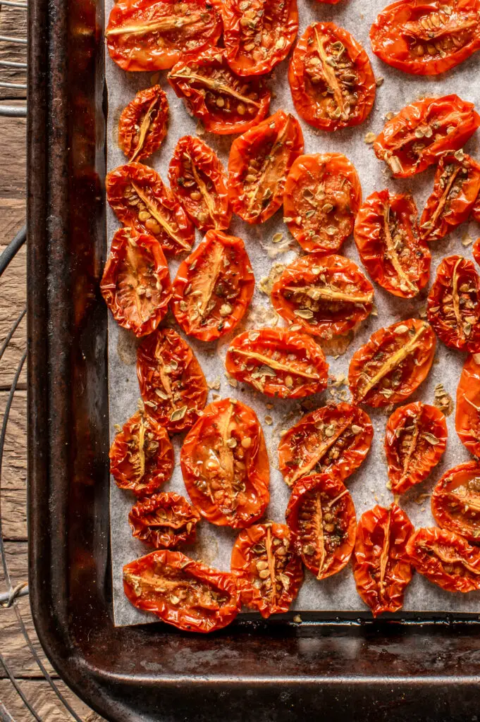 slow roasted cherry tomatoes on baking sheet