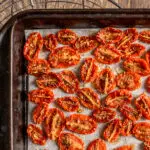 slow roasted cherry tomatoes on baking sheet
