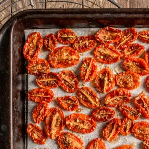 slow roasted cherry tomatoes on baking sheet