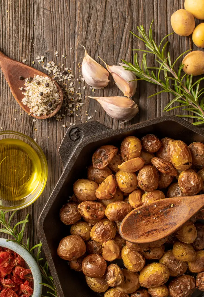 roasted potatoes and garlic in skillet