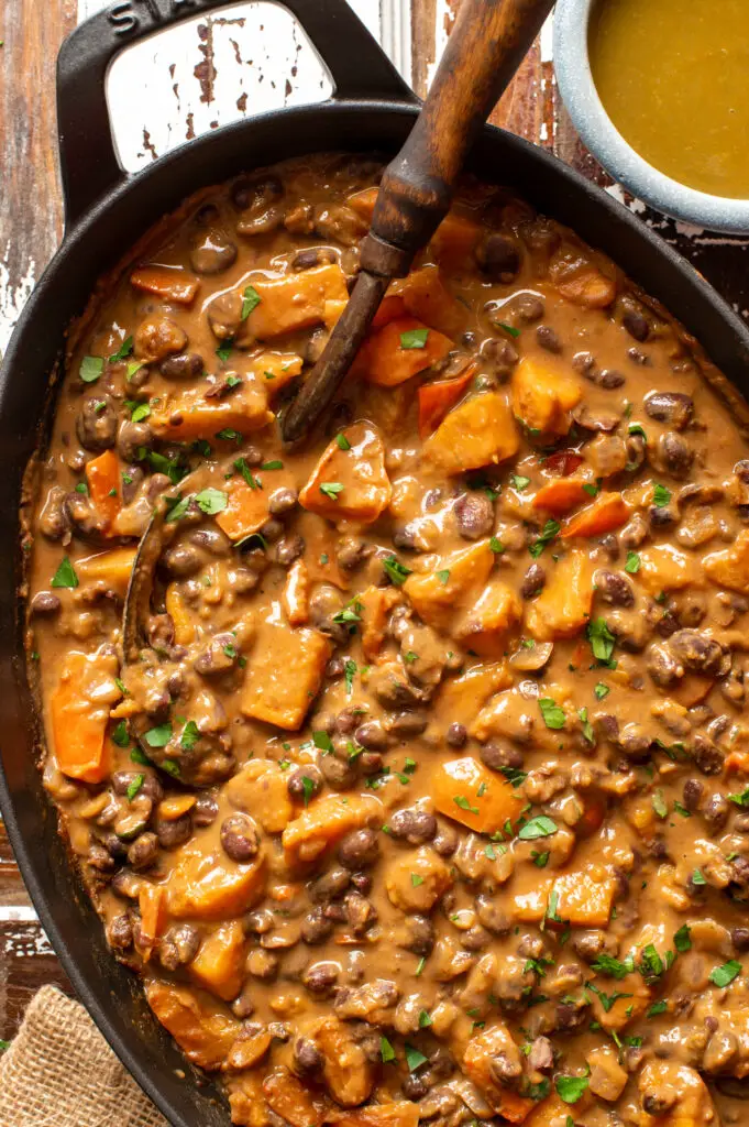 black bean and sweet potato stew in iron skillet