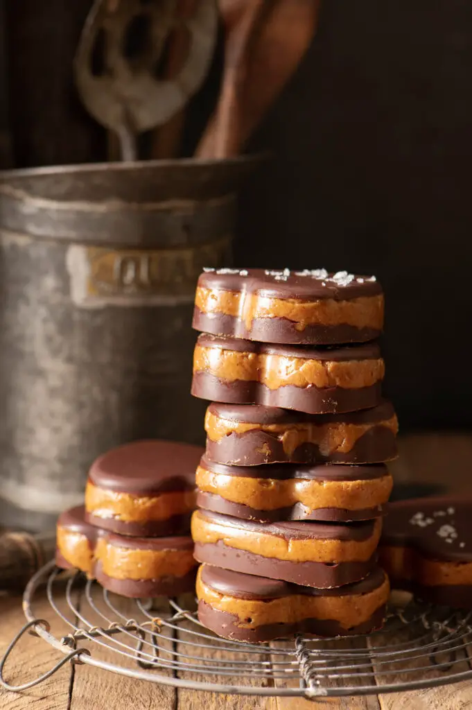 stacked almond butter cups on cooling rack