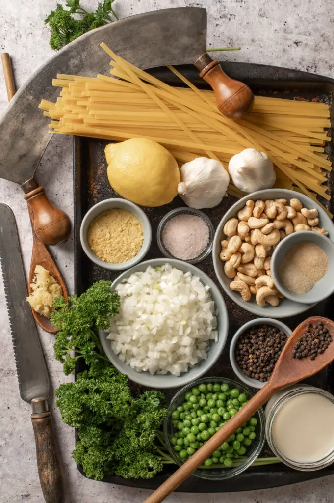 vegan pasta alfredo ingredients on baking sheet