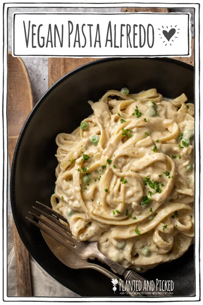 vegan pasta alfredo in black bowl on cutting board - pinterest image