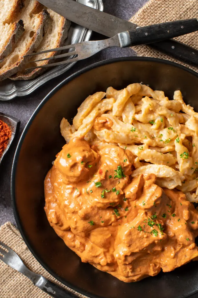 vegan hungarian tofu paprikash in black bowl