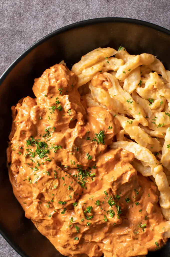 vegan hungarian tofu paprikash in black bowl