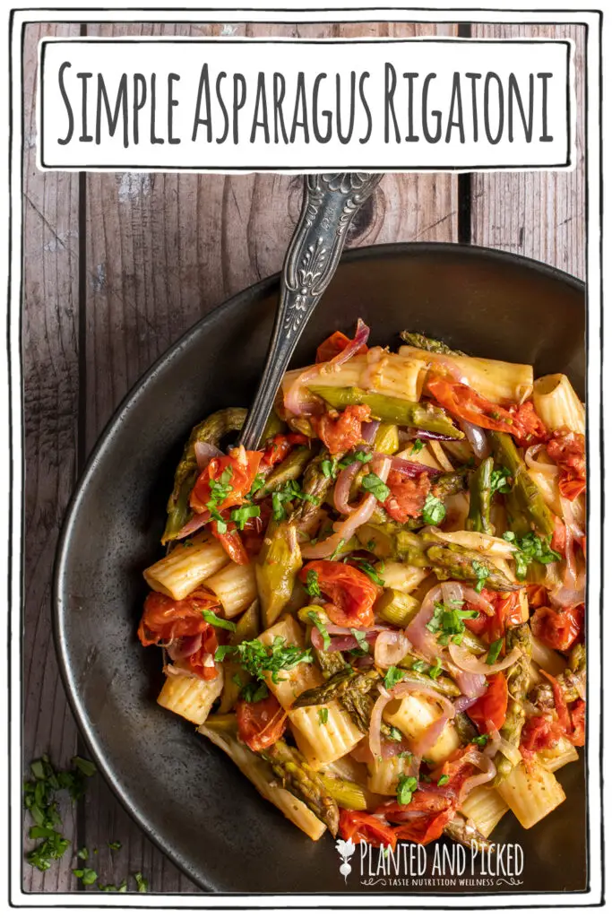 simple asparagus rigatoni in black bowl