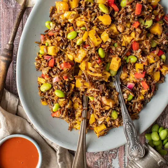 wild rice and mango salad on serving platter - recipe image