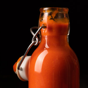 cayenne pepper hot sauce in glass jar - recipe image