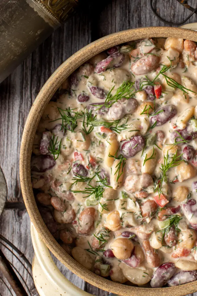 middle eastern bean salad in pottery crock