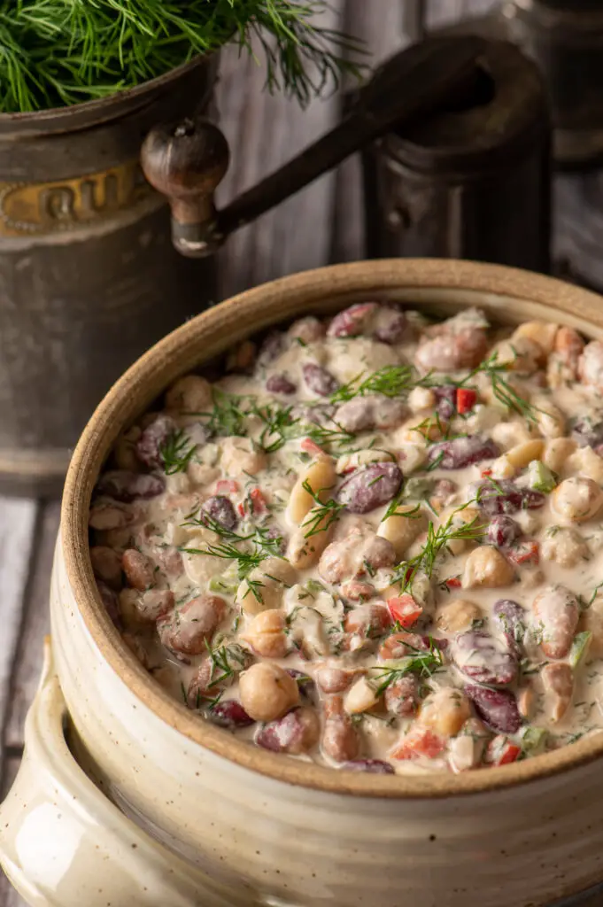 middle eastern bean salad in pottery crock