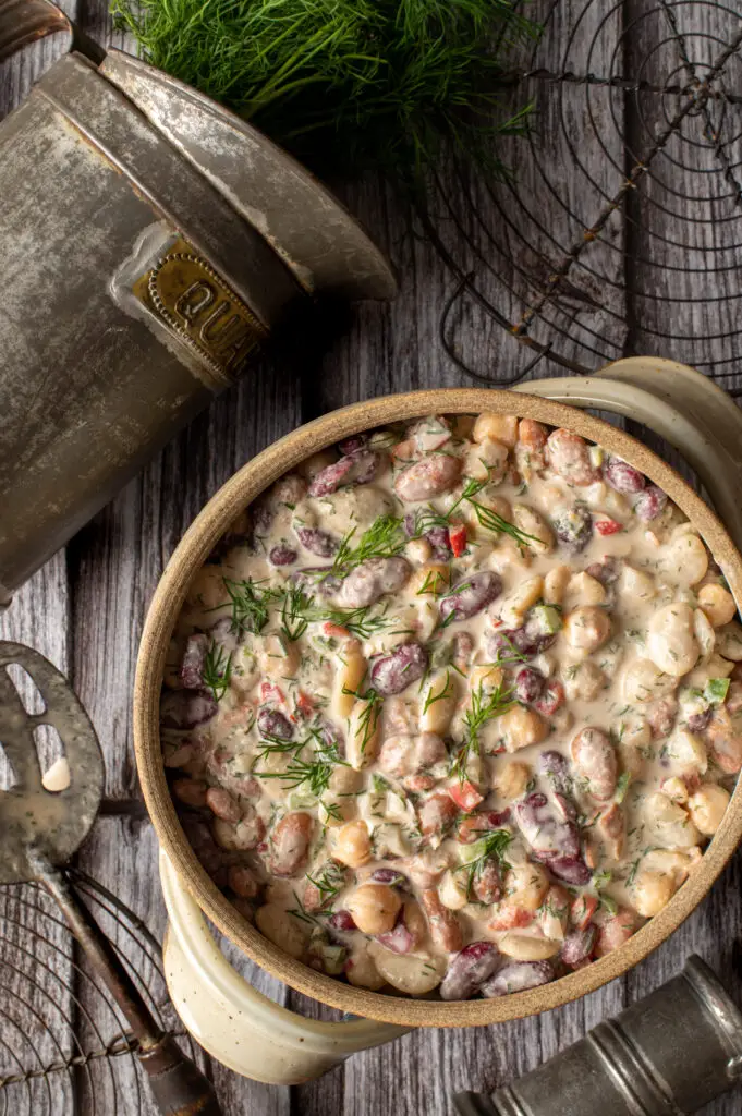 middle eastern bean salad in pottery crock