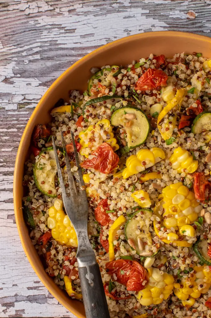 quinoa with summer vegetables on plate
