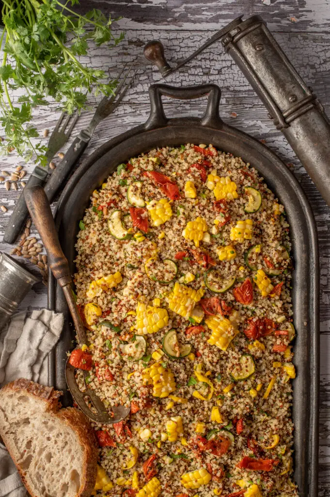 quinoa with summer vegetables on cast iron griddle