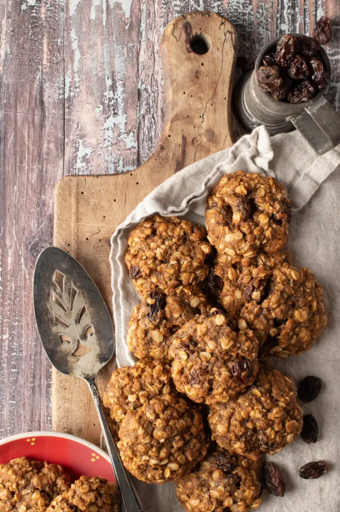 vegan oatmeal raisin cookies on old cutting board