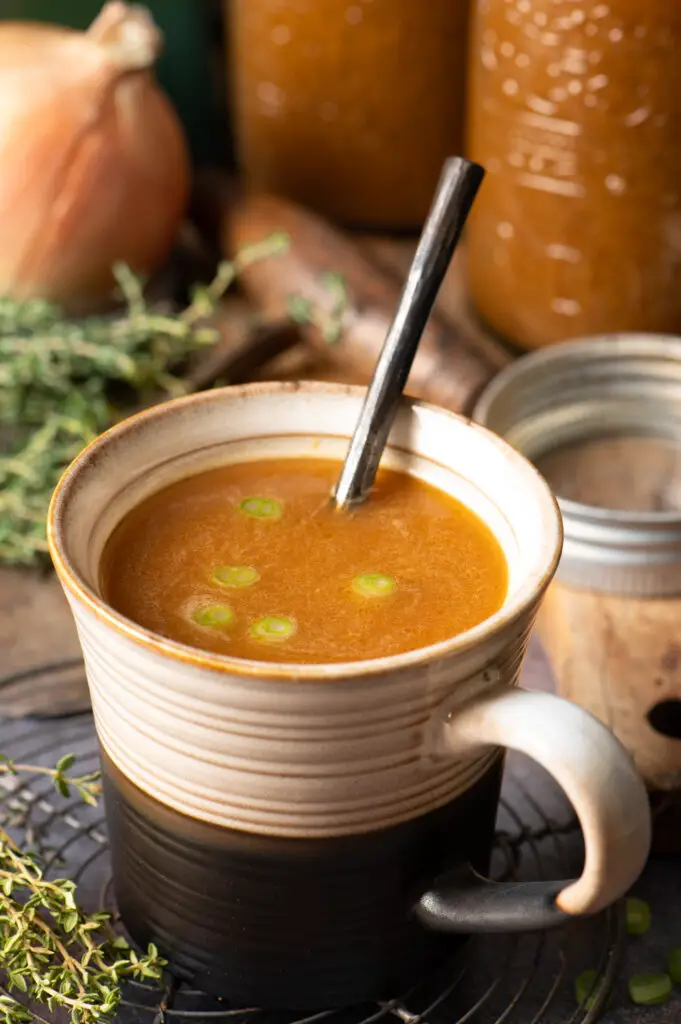 prepared vegetable broth in soup mug