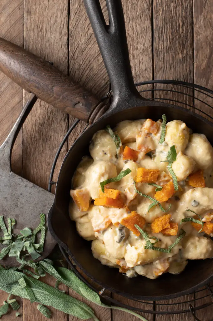 creamy butternut squash gnocchi in iron skillet